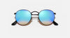 Round sunglasses with blue gradient lenses on a white background