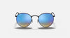Round sunglasses with blue gradient lenses on a black frame