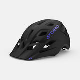 Giro Verce MIPS Women's Mountain Bike Helmet in a trail setting Matte Black Electric Purple Hero