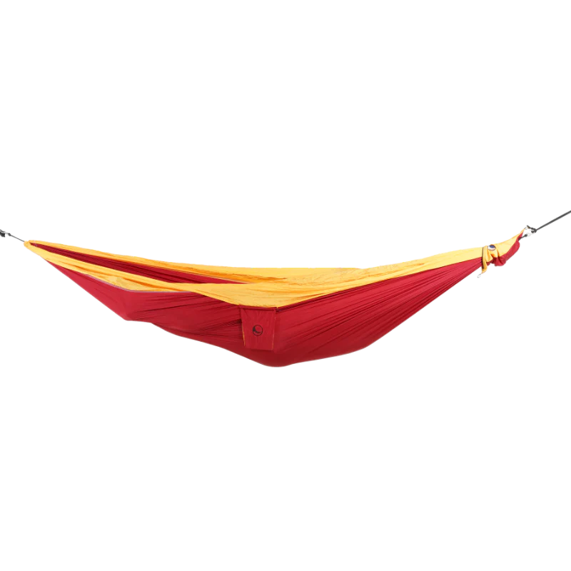 Ticket to the Moon Original Outdoor Hammock set up between trees in a park.