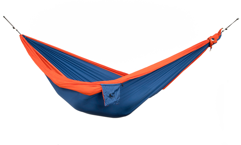 Ticket to the Moon Original Outdoor Hammock set up between trees in a park. Royal Blue Orange