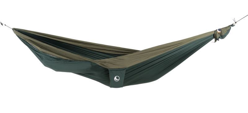 Ticket to the Moon Original Outdoor Hammock set up between trees in a park. Green Army