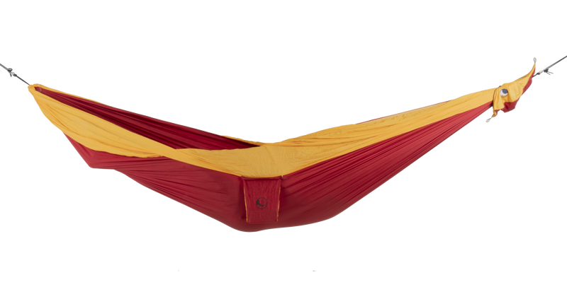 Ticket to the Moon Original Outdoor Hammock set up between trees in a park. Yellow Red