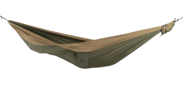 Ticket to the Moon Original Outdoor Hammock set up between trees in a park.